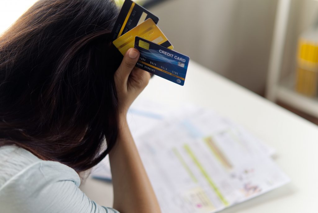 A person stressed about credit card debt.